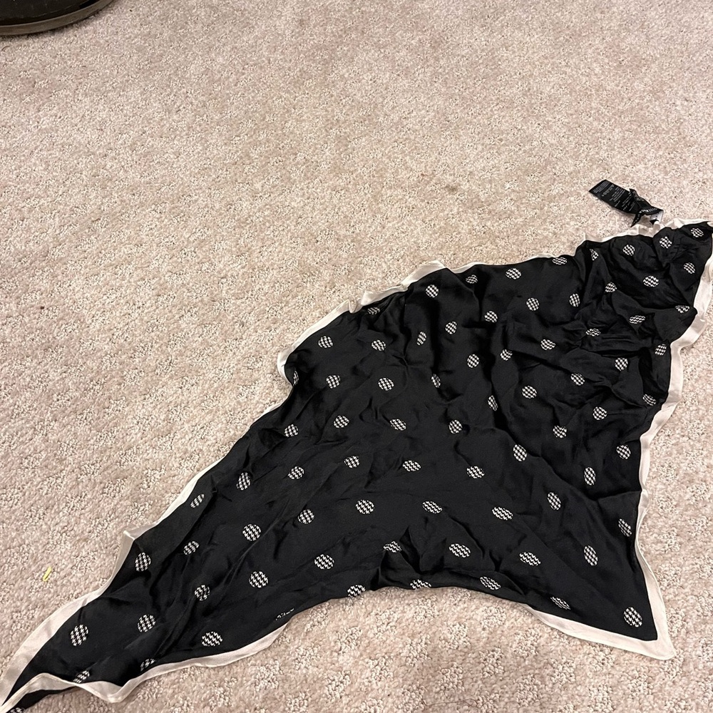 White House Black Market is 100% silk scarf